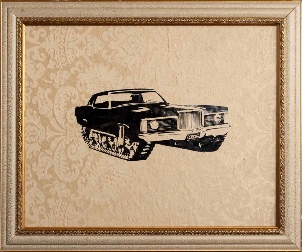 graphic of car on fabric inside a frame