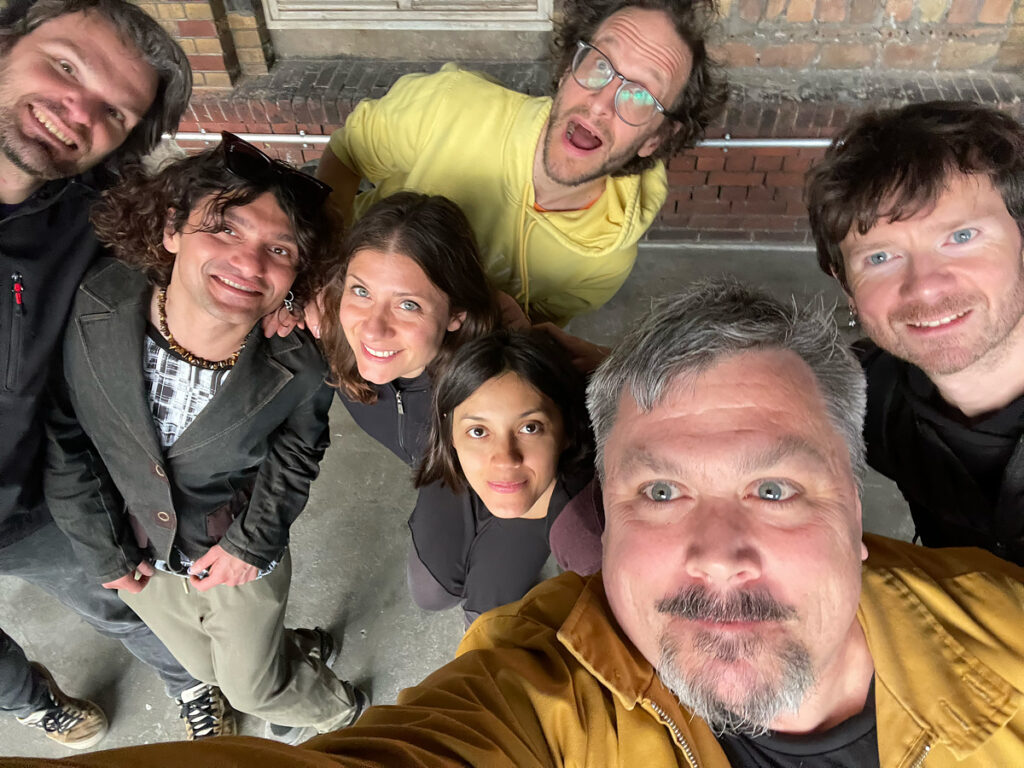 A group of seven smiling people