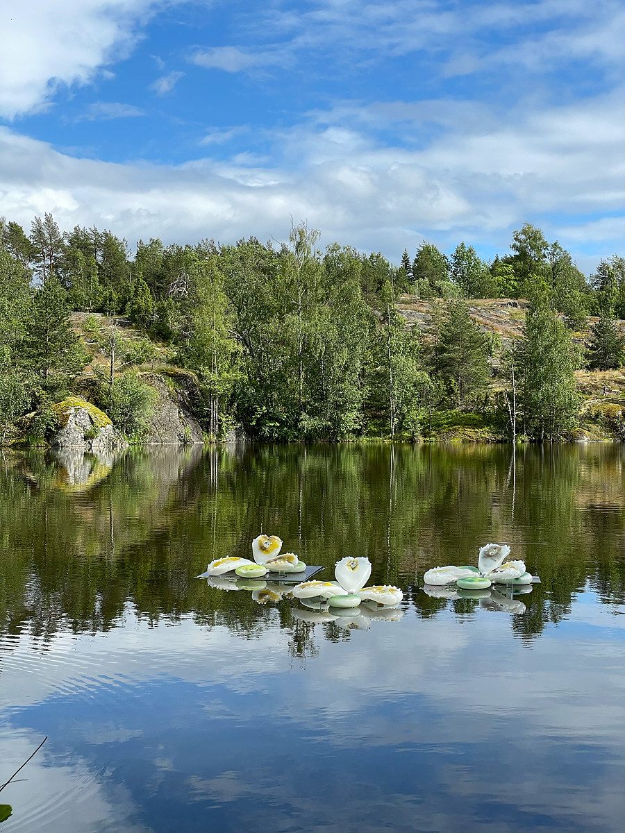 Glass sculptures floating in a lake