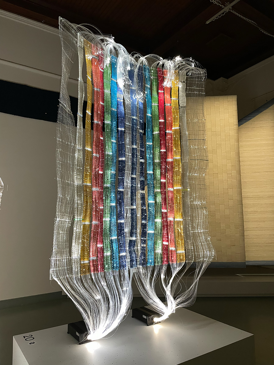 Hanging tapestry made of fiber optic cables