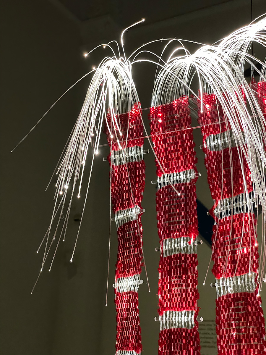 Hanging tapestry made of fiber optic cables
