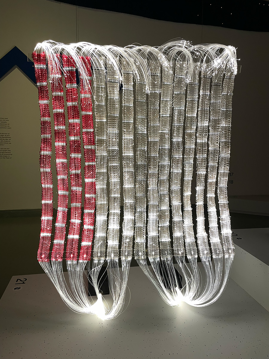 Hanging tapestry made of fiber optic cables