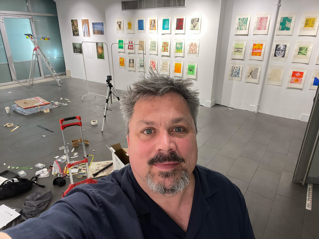 Man smiling in art gallery