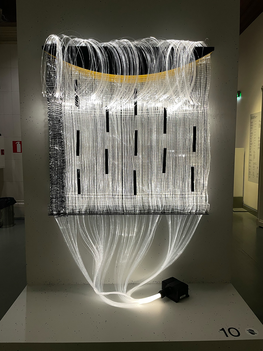 Hanging tapestry made of fiber optic cables