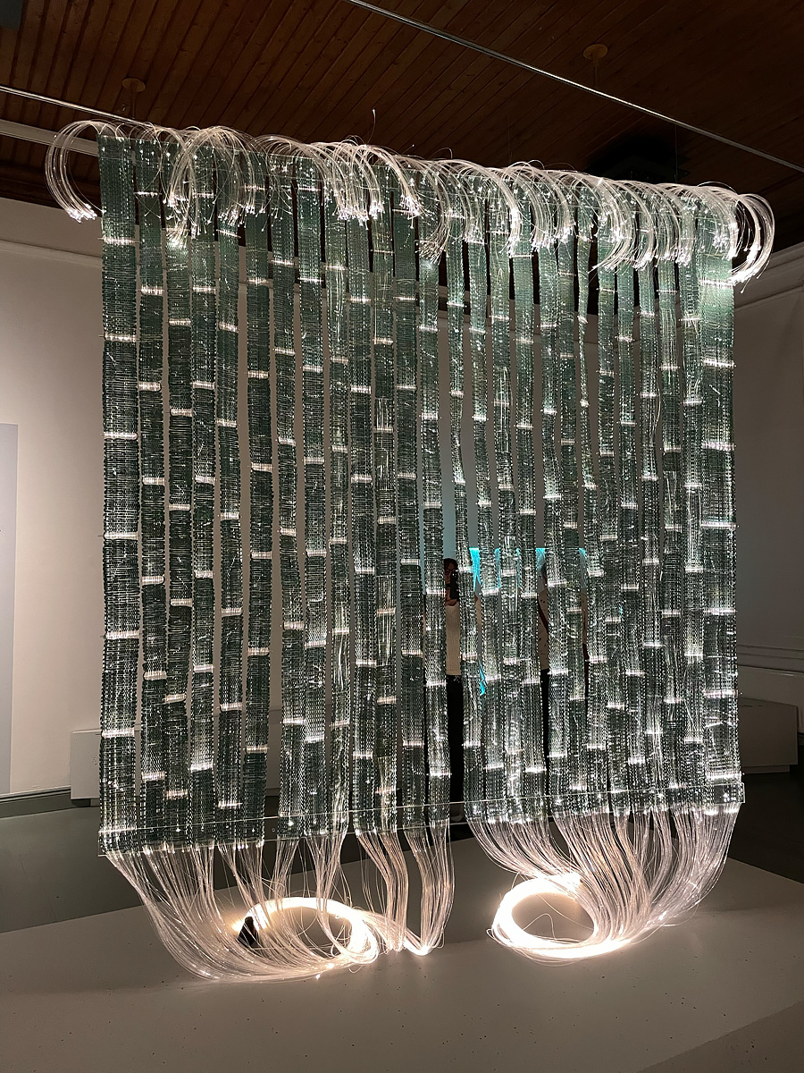 Hanging tapestry made of fiber optic cables