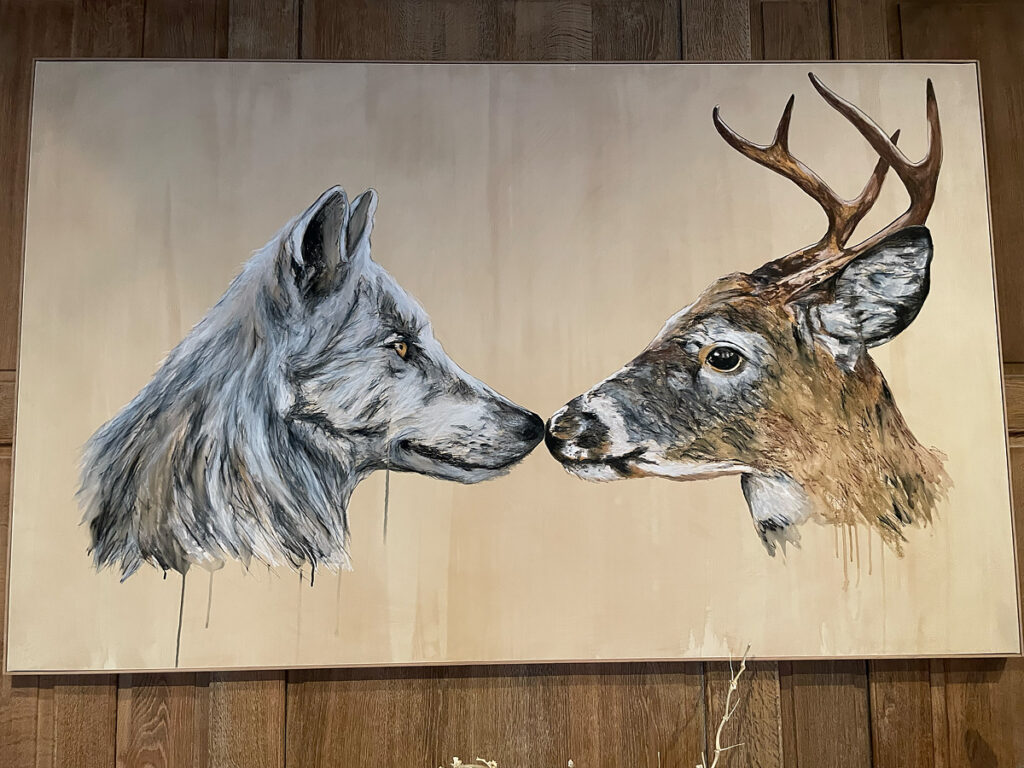 Painting of a wolf and deer